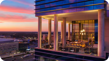 AC Hotel Orlando Downtown exterior at sunset