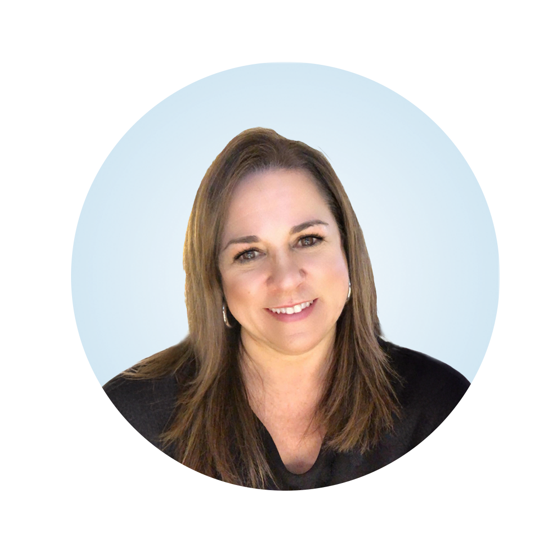 Head-and-shoulders portrait of a smiling woman with long brown hair, wearing a black top, against a light blue circular background